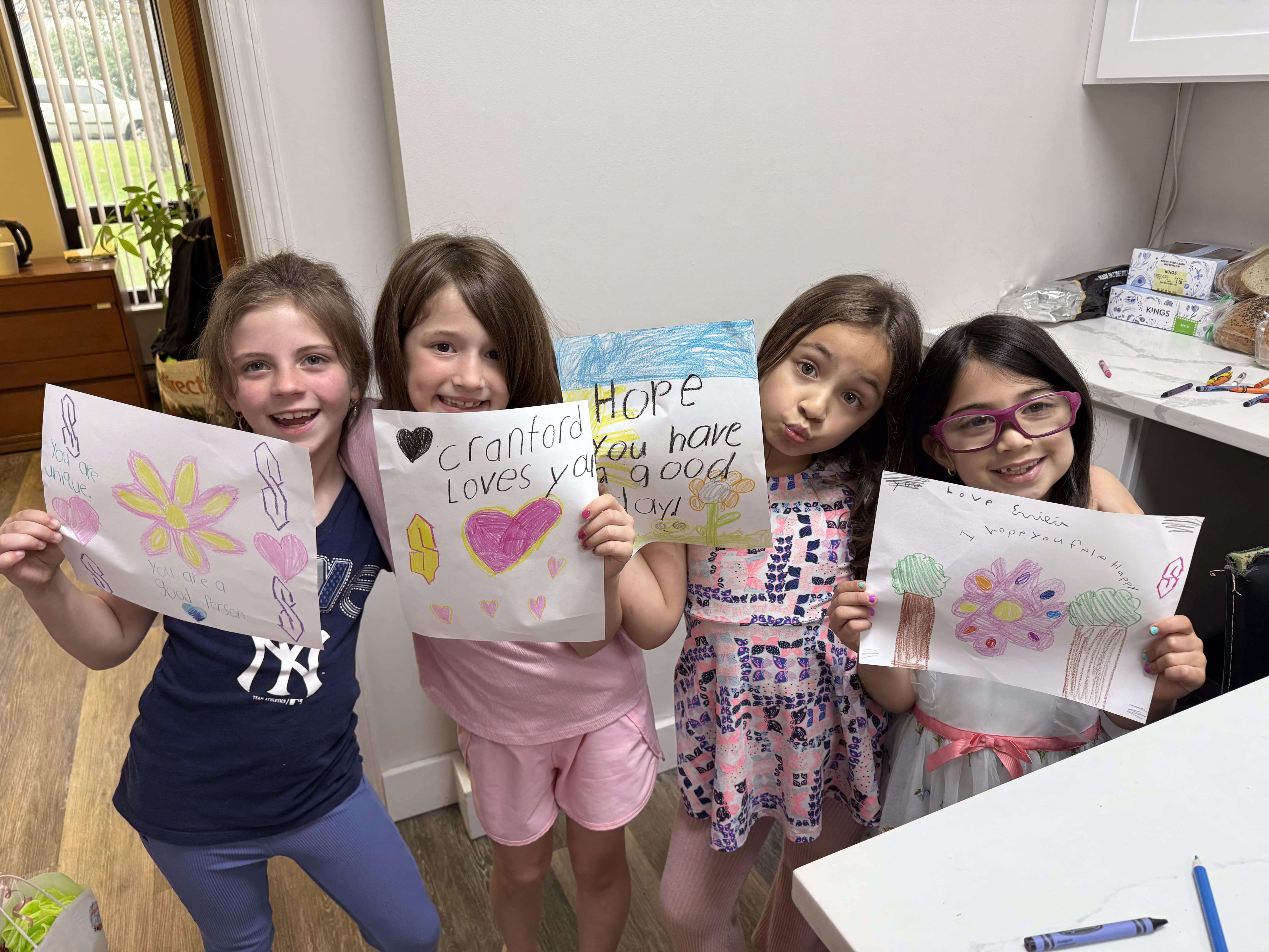 Children volunteering at Cranford Family Care.