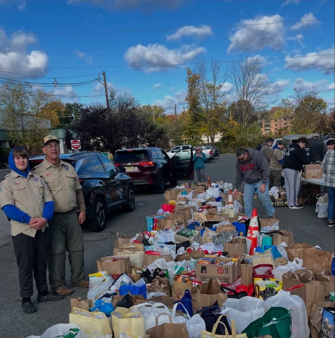 Scouts with donations from a food drive.